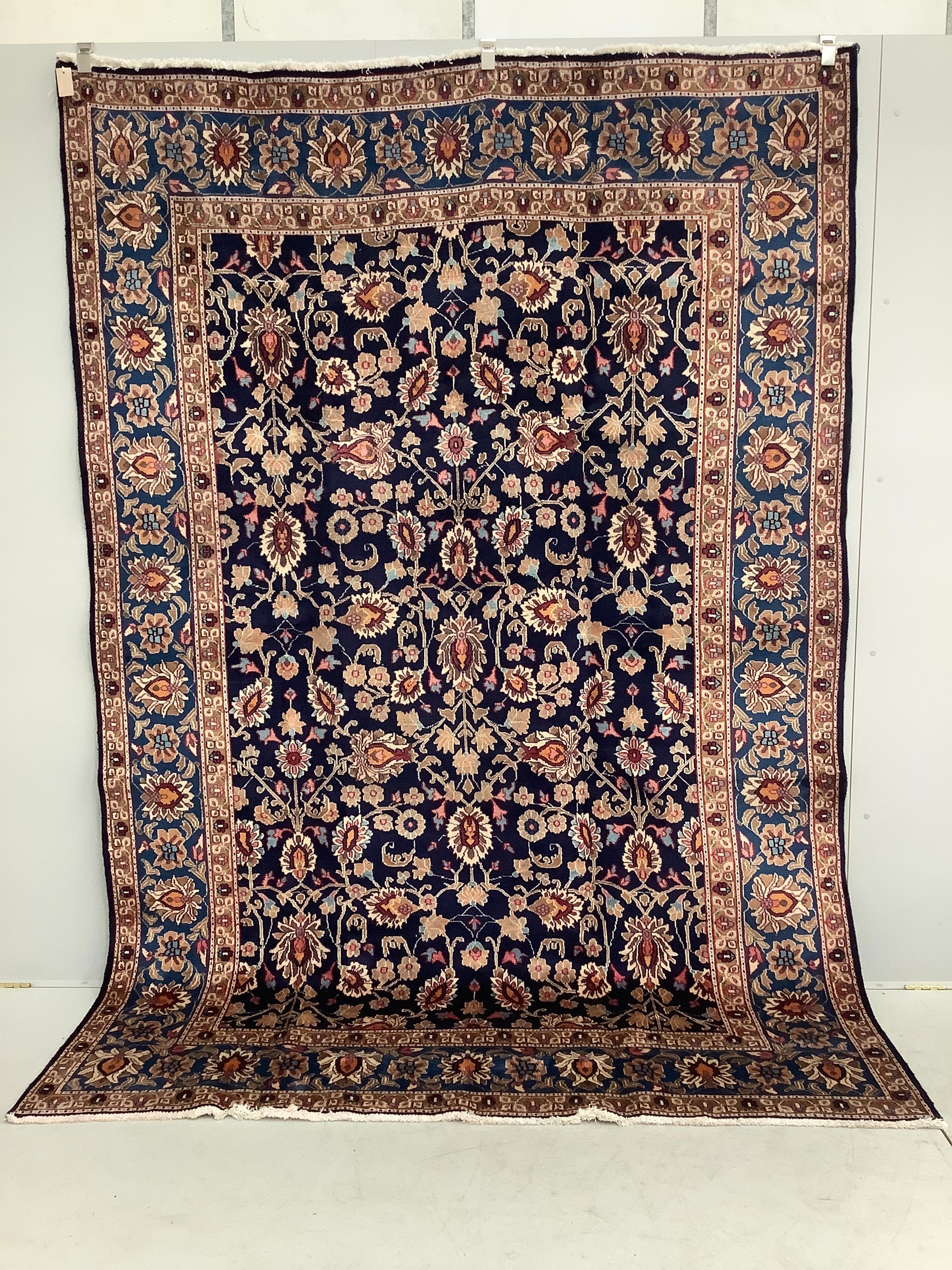 A Kashan blue ground carpet, 290 x 195cm